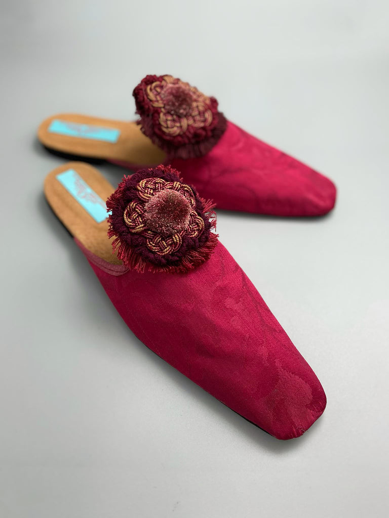 Raspberry red 19th century silk damask square toed backless slipper shoes with antique French passementerie silk chenille and cord medallion rosettes. Bohemian style created from antique textiles by the Pavilion Parade studio.