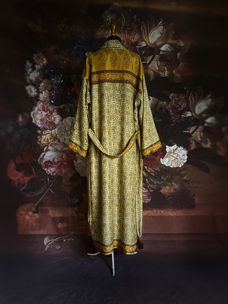 Saffron and mustard yellow  silk-lined wool long dressing robe or duster. Deep pockets, wides sleeves, and tassel sash belt. Bohemian luxury sustainably created from antique and vintage textiles by Pavilion Parade