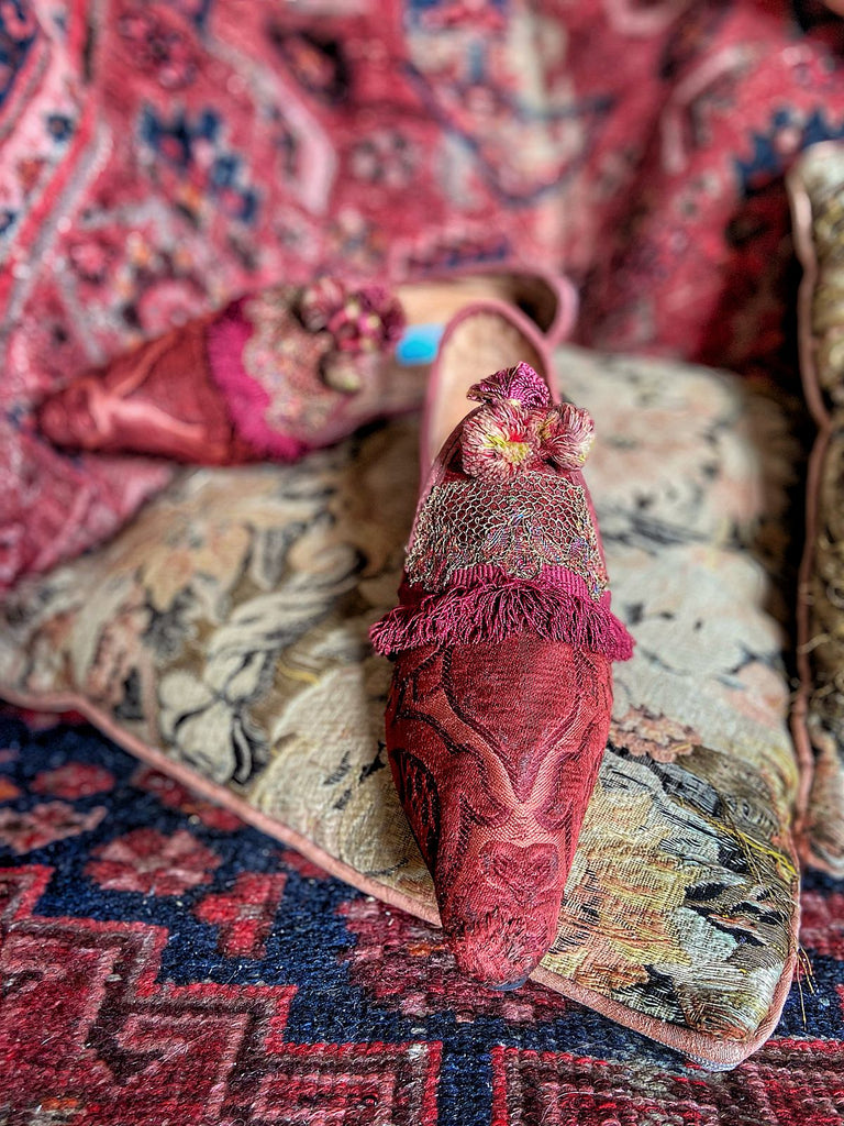 Rust red bohemian shoes created from a fragment of antique Italian silk brocade and assorted tassel and passementerie embellishments by Pavilion Parade