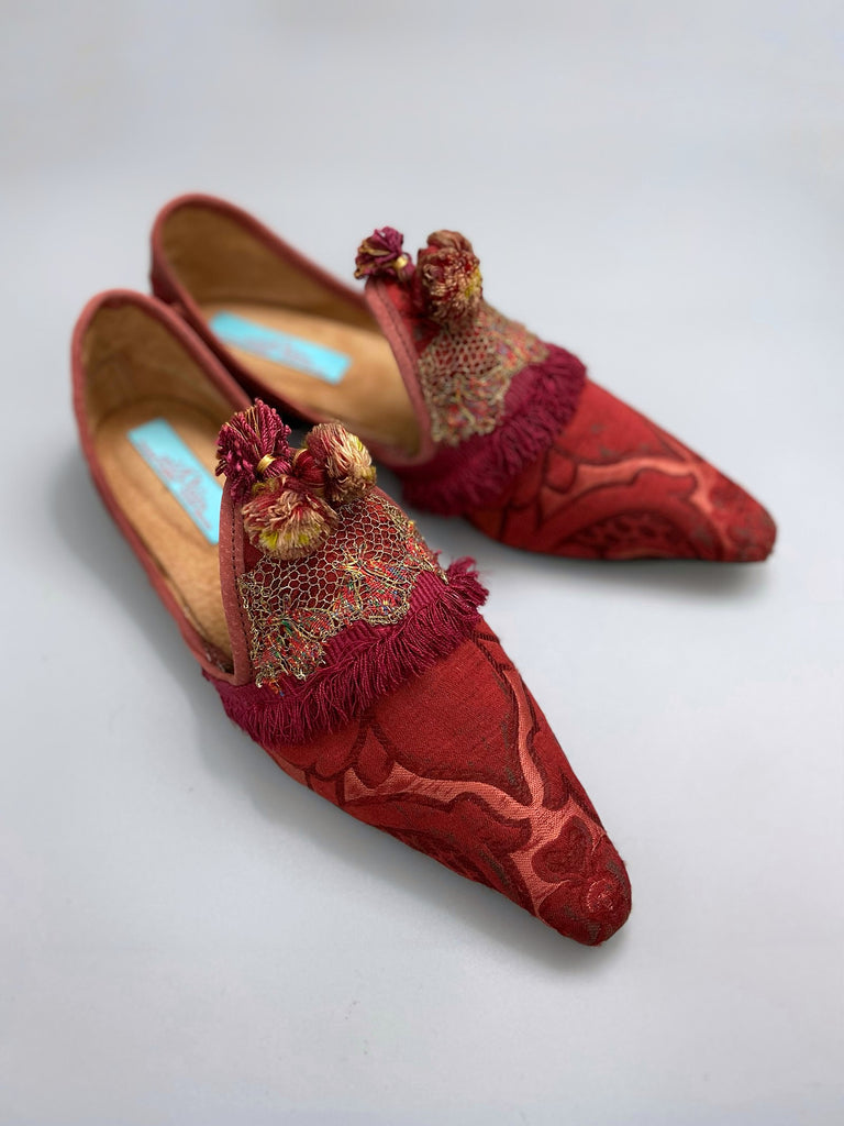 Rust red bohemian shoes created from a fragment of antique Italian silk brocade and assorted tassel and passementerie embellishments by Pavilion Parade