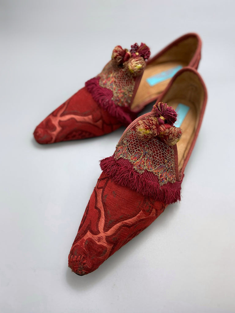 Rust red bohemian shoes created from a fragment of antique Italian silk brocade and assorted tassel and passementerie embellishments by Pavilion Parade