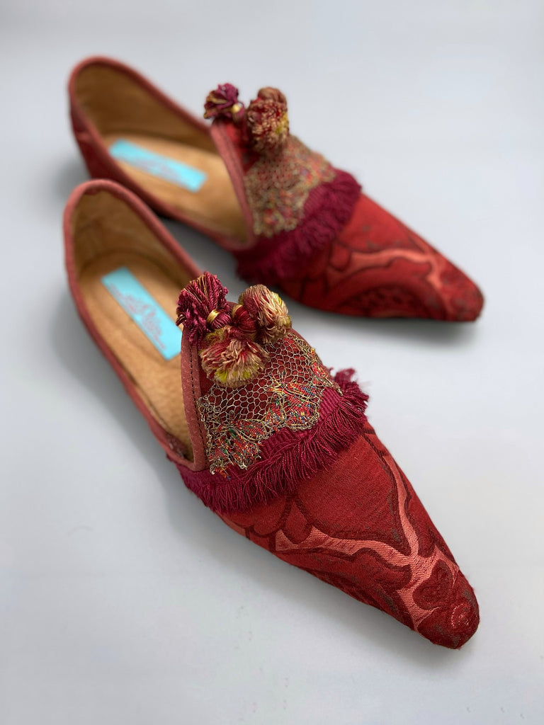 Rust red bohemian shoes created from a fragment of antique Italian silk brocade and assorted tassel and passementerie embellishments by Pavilion Parade