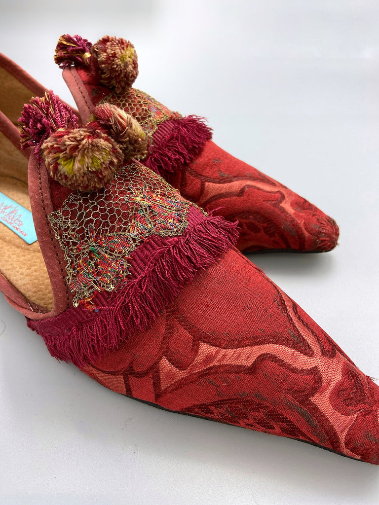 Rust red bohemian shoes created from a fragment of antique Italian silk brocade and assorted tassel and passementerie embellishments by Pavilion Parade