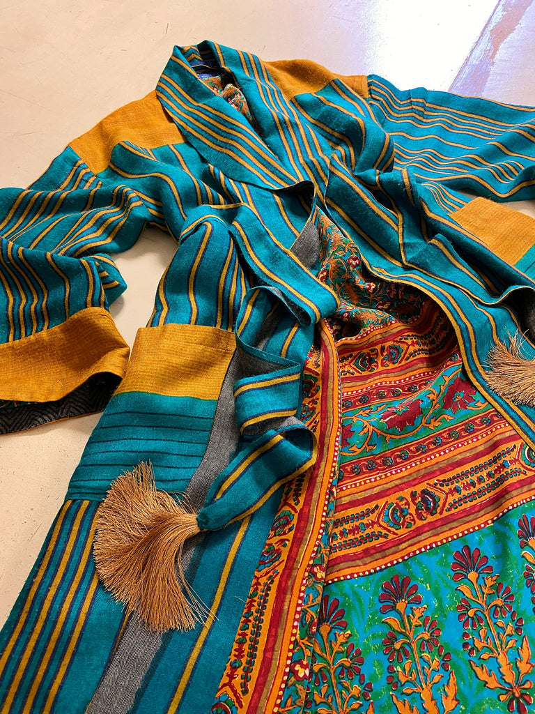 Teal green and canary yellow stripe fine wool robe lined in vibrant block printed silk crepe. Tassel sash belt, deep pockets and wide sleeves, Bohemian style sustainably create from vintage and antique textiles by the Pavilion Parade studio