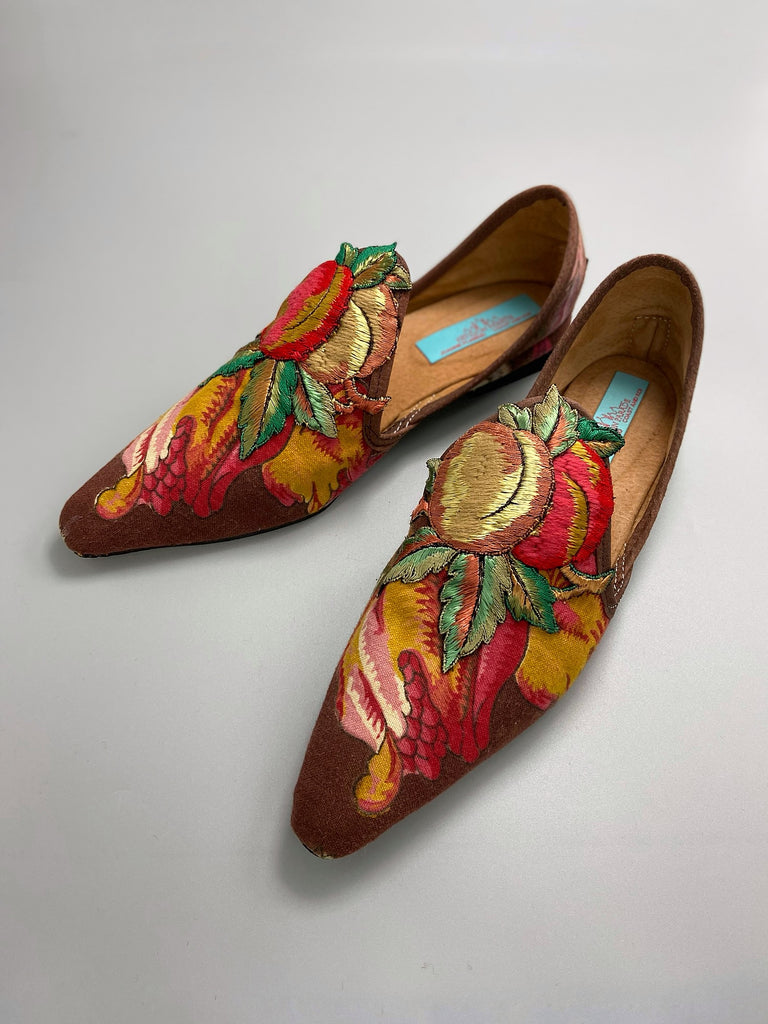 Vibrant colourful bohemian shoes created from an antique French  block printed Indienne cotton, with a design of fantastical flowers and foliage  and embroidered fruits. Sustainably made from antique textiles by Pavilion Parade