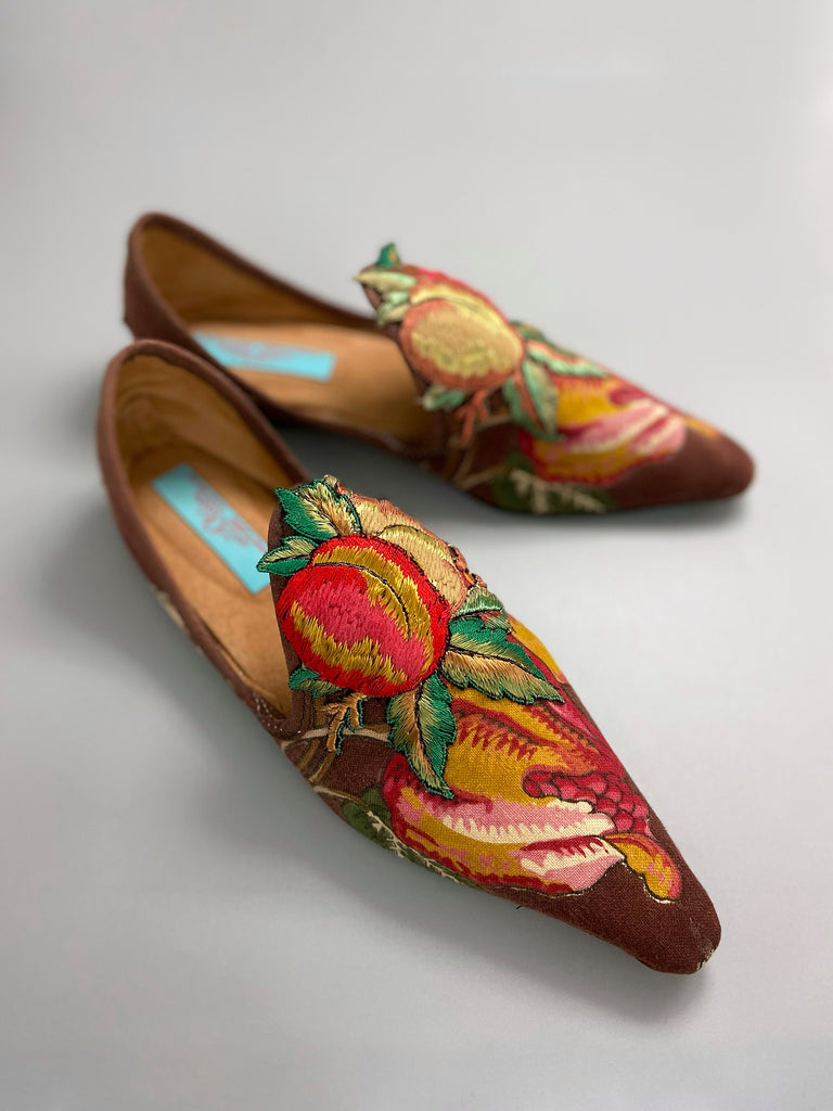Vibrant colourful bohemian shoes created from an antique French  block printed Indienne cotton, with a design of fantastical flowers and foliage  and embroidered fruits. Sustainably made from antique textiles by Pavilion Parade