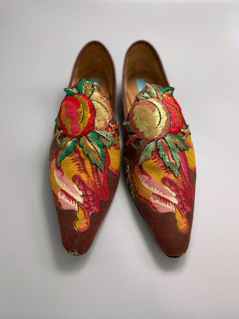 Vibrant colourful bohemian shoes created from an antique French  block printed Indienne cotton, with a design of fantastical flowers and foliage  and embroidered fruits. Sustainably made from antique textiles by Pavilion Parade