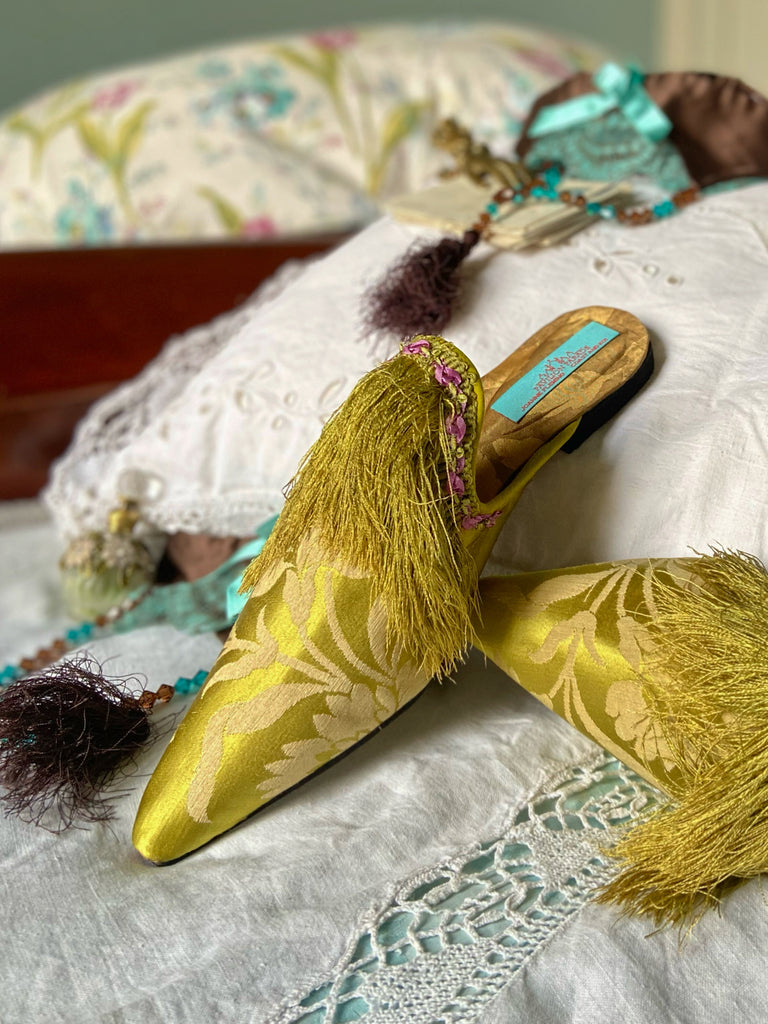 La Fée Verte silk damask bohemian shoes created from antique textiles by Pavilion Parade. Embellished with circa 1700 Florentine silk fringe and 1920s lilac rococo ribbon flower trim. 
