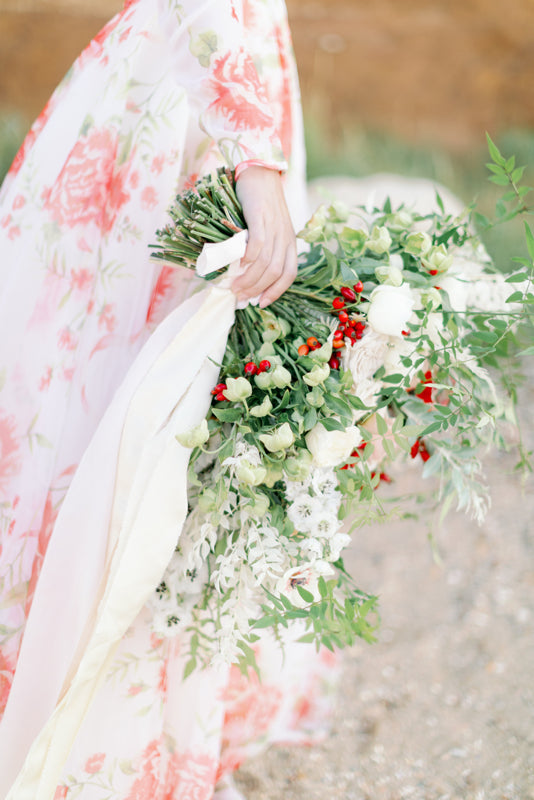 Ivory and coral red floral silk organza ball gown  wedding dress with long puffed sleeves and deep illusion plunge neckline. A Flight of Fancy from Pavilion Parade