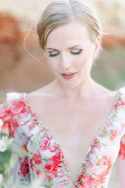 Ivory and coral red floral silk organza ball gown  wedding dress with long puffed sleeves and deep illusion plunge neckline. A Flight of Fancy from Pavilion Parade