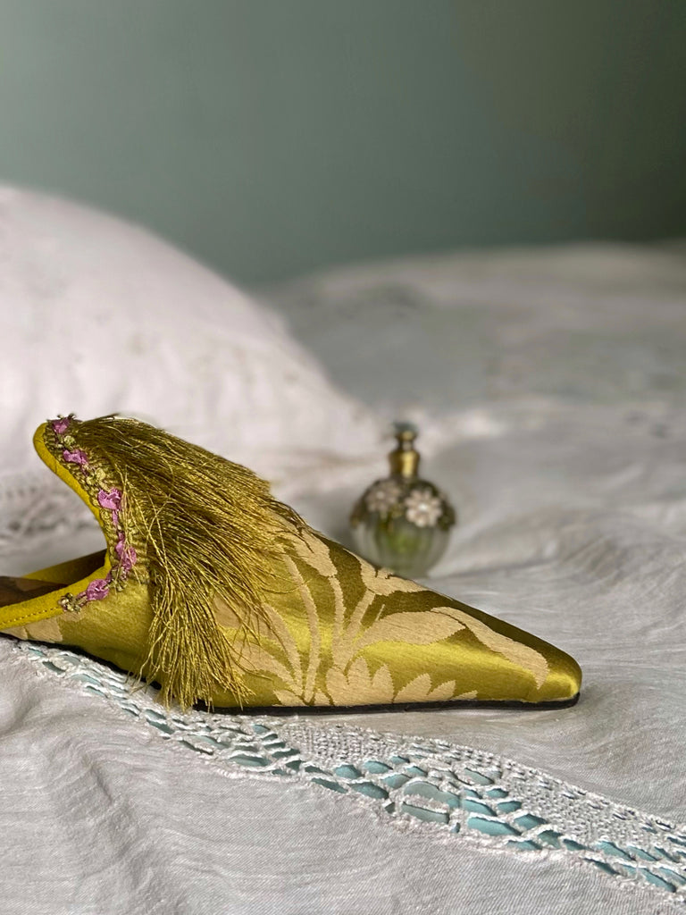 La Fée Verte silk damask bohemian shoes created from antique textiles by Pavilion Parade. Embellished with circa 1700 Florentine silk fringe and 1920s lilac rococo ribbon flower trim. 