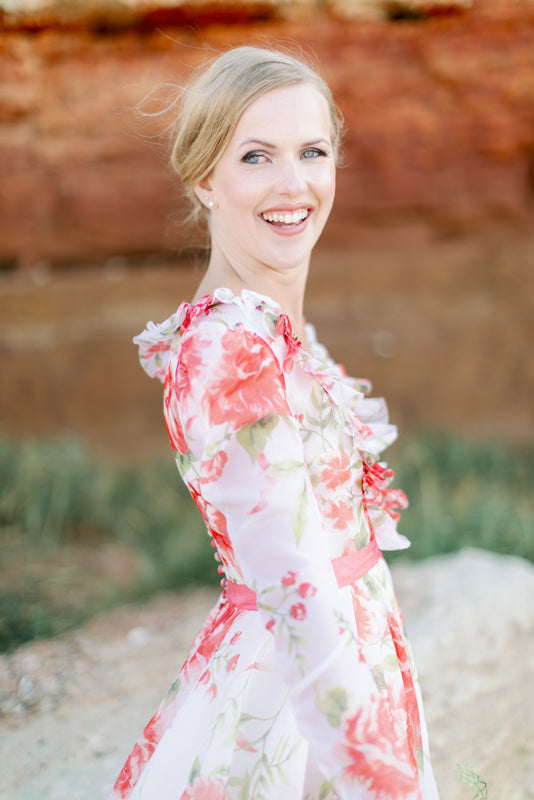 Ivory and coral red floral silk organza ball gown  wedding dress with long puffed sleeves and deep illusion plunge neckline. A Flight of Fancy from Pavilion Parade