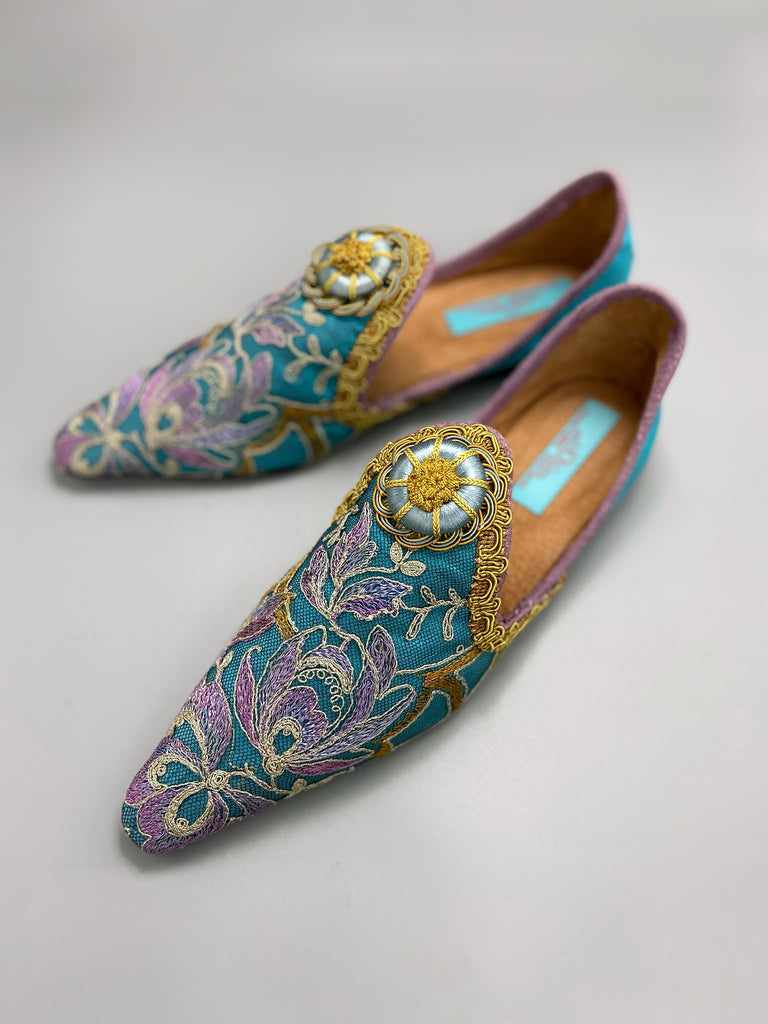 Pointed toe shoes created from antique lilac and gold lace over azure blue silk, with gold braid and vintage Passementerie rosette embellishment. Created by Pavilion Parade.