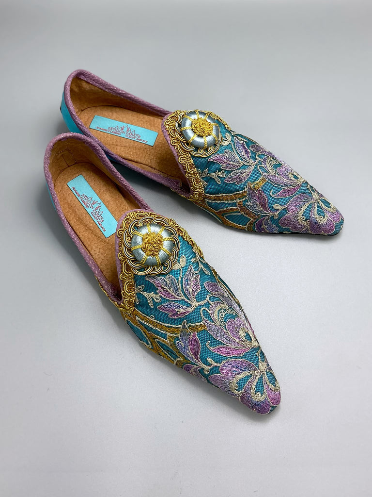 Pointed toe shoes created from antique lilac and gold lace over azure blue silk, with gold braid and vintage Passementerie rosette embellishment. Created by Pavilion Parade.