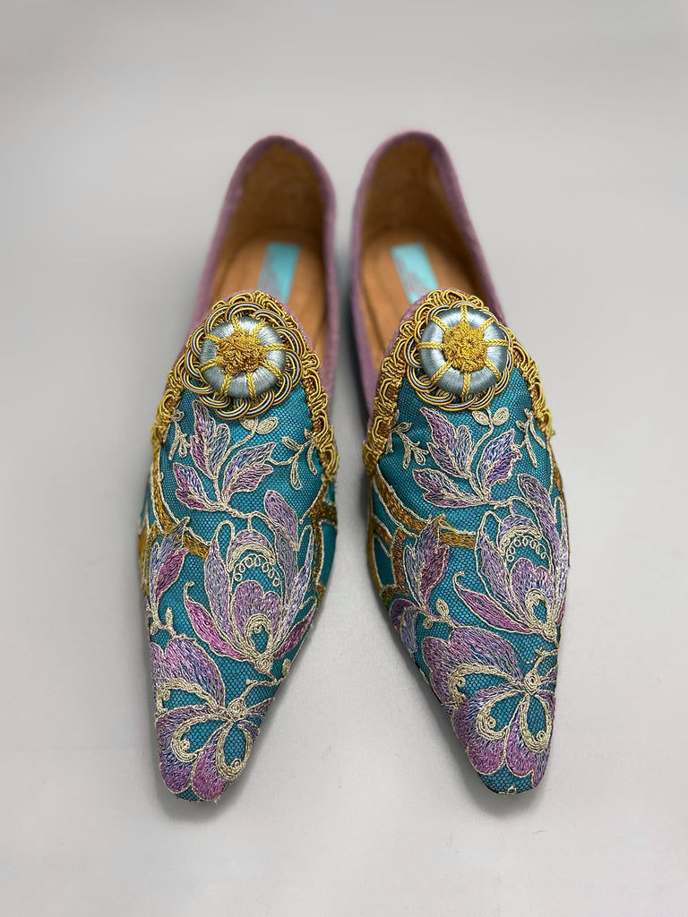 Pointed toe shoes created from antique lilac and gold lace over azure blue silk, with gold braid and vintage Passementerie rosette embellishment. Created by Pavilion Parade.